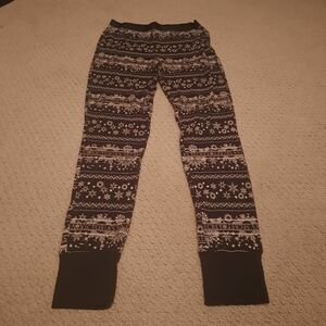 Victoria's Secret, size small, black leggings with a snowflake theme. Preowned
